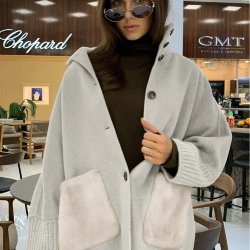 Cappotto lavorato a maglia con collo alto Terry in pelliccia sintetica